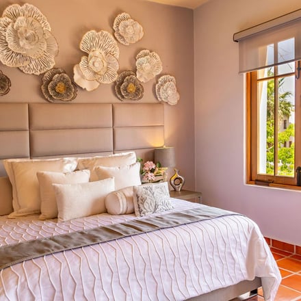 Casa del Cielo bedroom with floral wall art