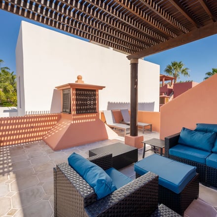 Casa de Sonrisas rooftop terrace with blue outdoor seating